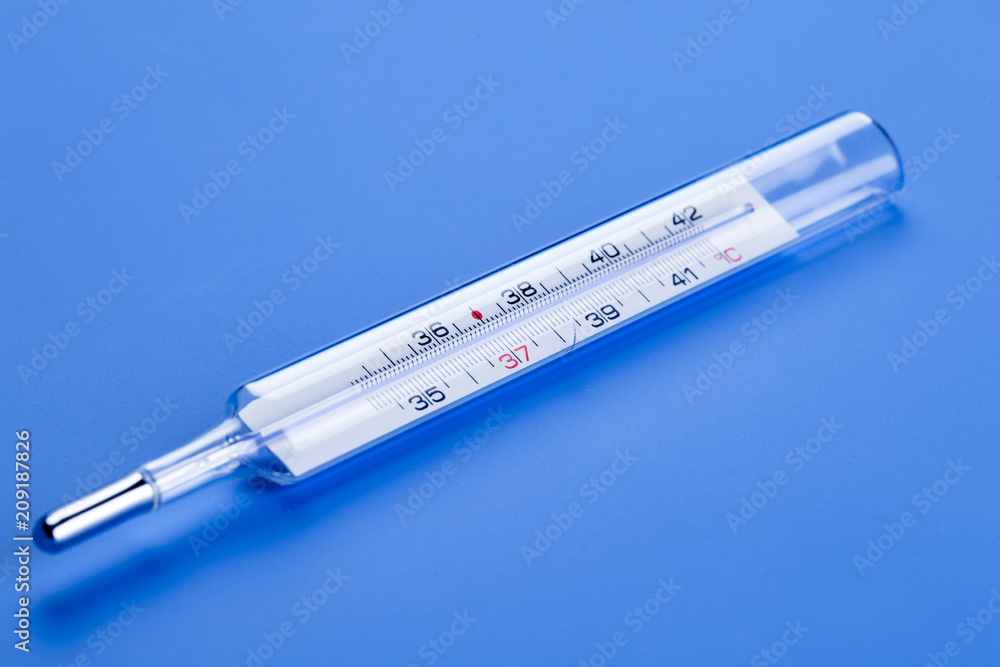 Obraz premium medical thermometer on a blue