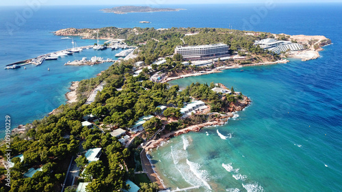 Fototapeta Naklejka Na Ścianę i Meble -  Aerial drone bird's eye photo of famous marina of Vouliagmeni with luxury yachts docked in south Athens riviera Peninsula with turquoise clear waters, Greece