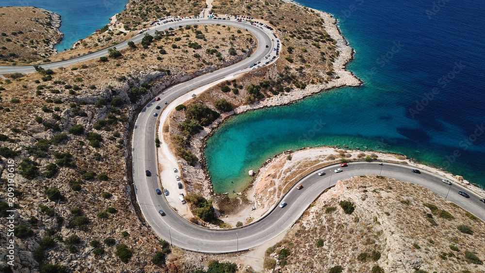 Aerial drone bird's eye view photo of Tunnel in Athens riviera seaside road known as hole of Karamanlis, Attica, Greece