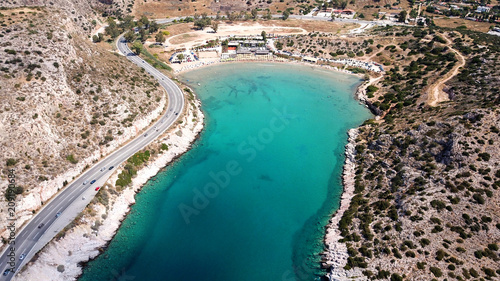 Fototapeta Naklejka Na Ścianę i Meble -  Aerial drone bird's eye view photo of Tunnel in Athens riviera seaside road known as hole of Karamanlis, Attica, Greece