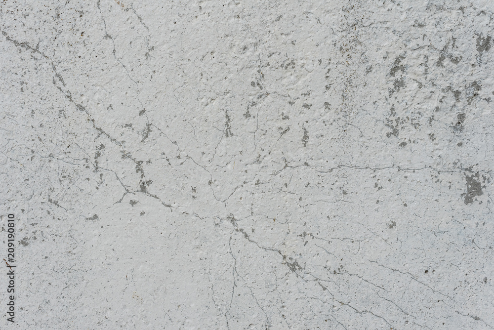 Fototapeta premium Wall fragment with scratches and cracks