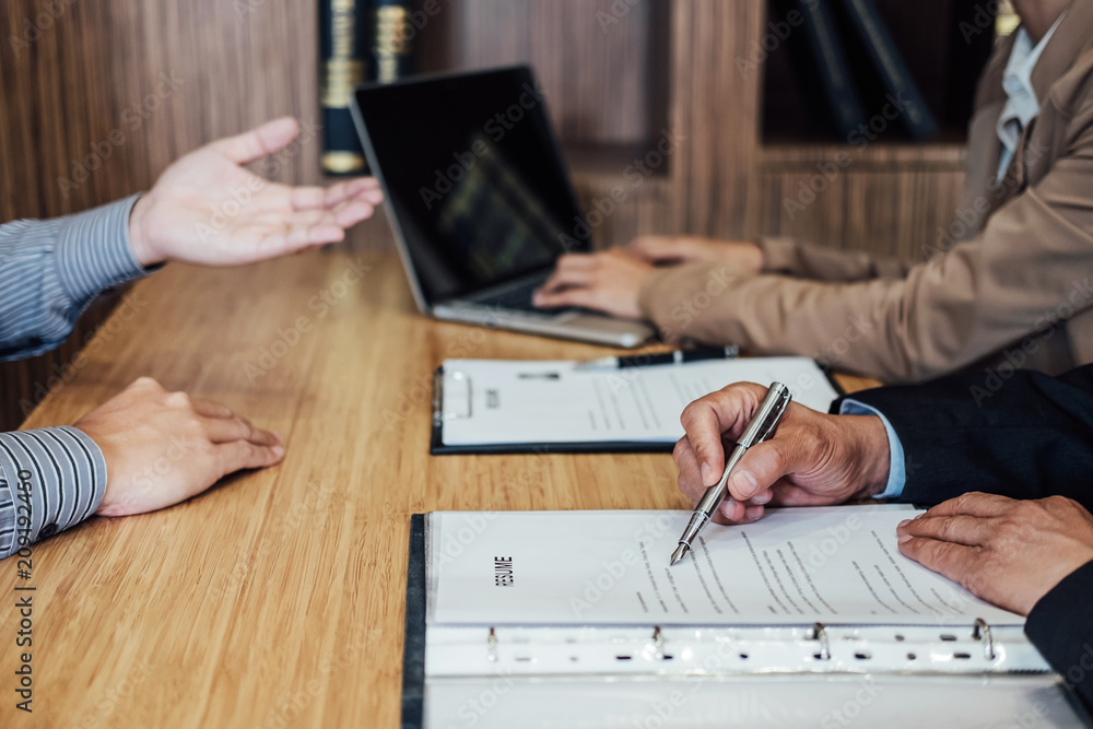Business man explaining about his profile to two senior manager sitting in during job Interview, interview the job and hiring