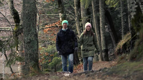 Wallpaper Mural Romantic Journey - Unidentified Couple In Love Walks Holding By Hands In Warm Clothes In The Autumn Picturesque Forest And Admiring The View Torontodigital.ca