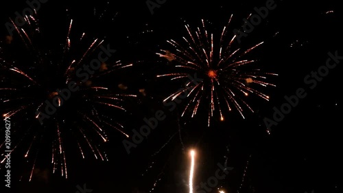 Colorful fireworks at holiday night. 4K video of salutes.
