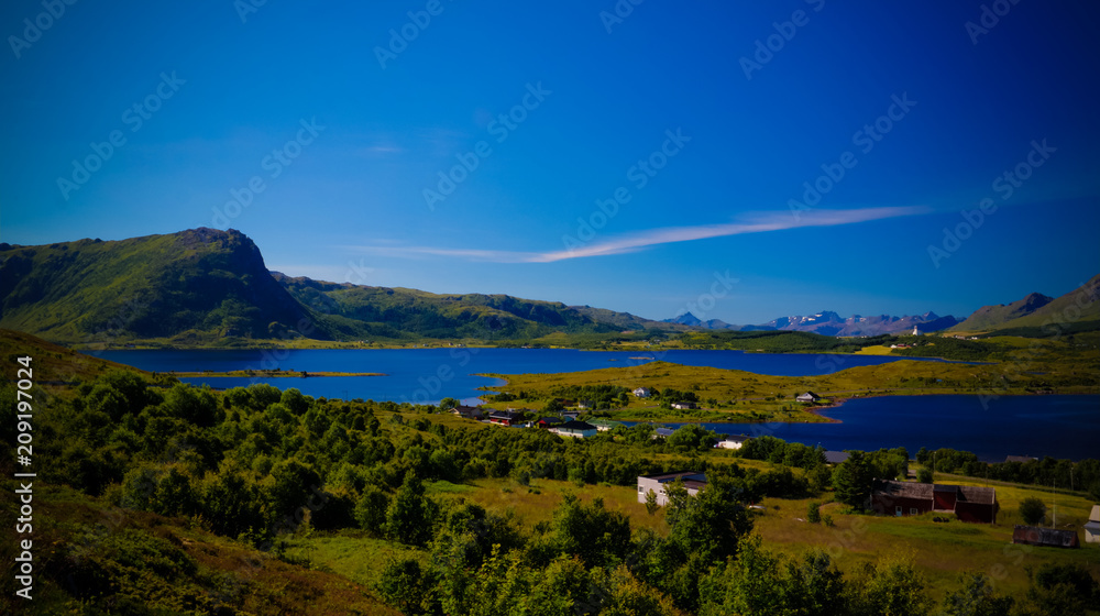Fototapeta premium Panoramic view to Bostad village and Borgpollan fjord from Torvdalshalsen viewpoint at Vestvagoy Island, Lofoten, Norway