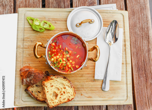 Traditional Hungarian goulash soup with a beautiful serving in the national restaurant. The concept of local cuisine in Budapest photo