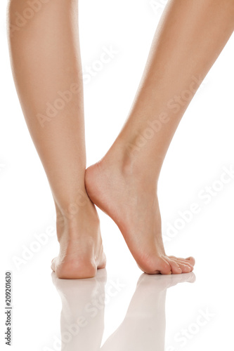 beautifully groomed bare feet on white background © vladimirfloyd