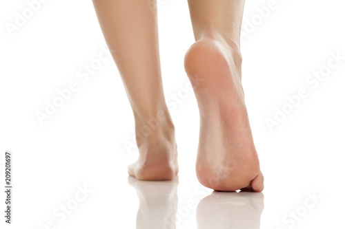 beautifully groomed bare feet on white background