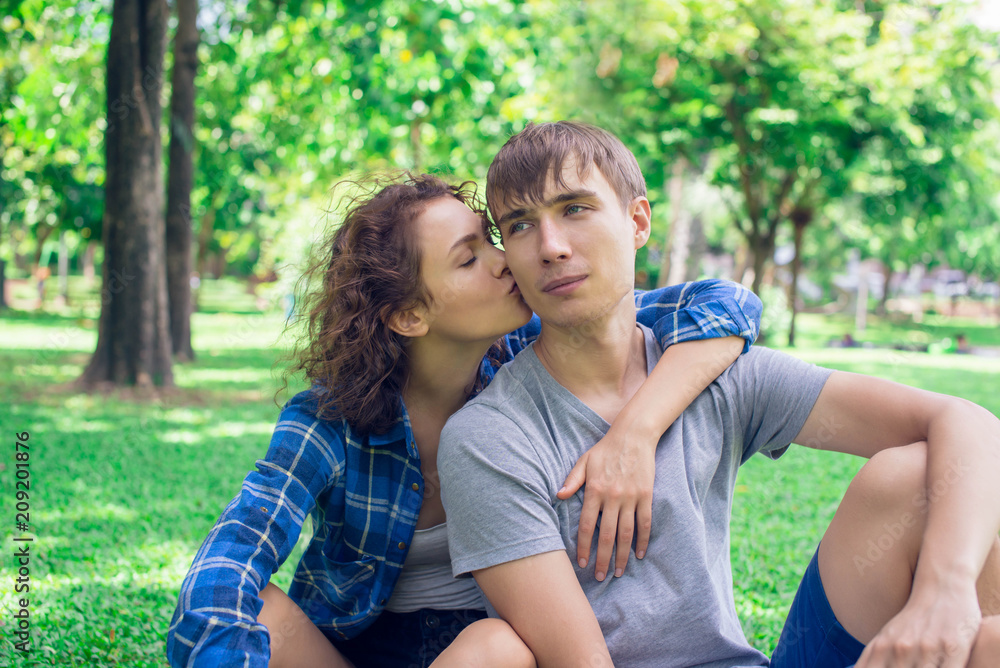 Fototapeta premium Girl kissing a boy outdoor