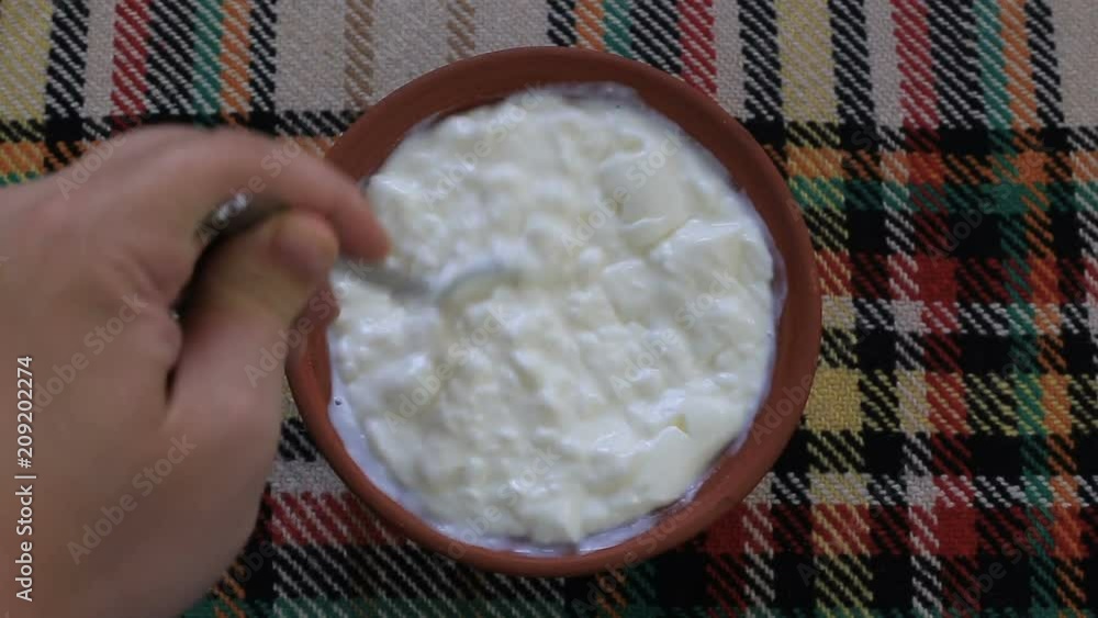 Mixing traditional bulgarian yogurt Mixing traditional bulgarian yogurt