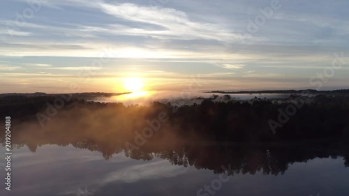 Wallpaper Mural Aerial shot over fog covered lakes during sunrise in Latgale, Latvia Torontodigital.ca