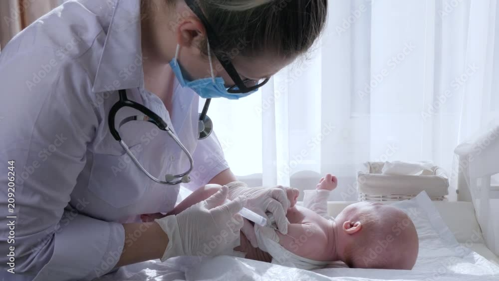 medical injection, woman doctor with syringe does an inoculation of ...