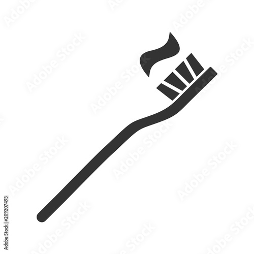 Toothbrush with toothpaste glyph icon