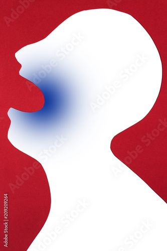 concept of disease diagnosis and pain localization on silhouette - close-up contour of abstract white man head, opened mouth, anesthesia in dentistry, isolated on red background, top view, flat lay.