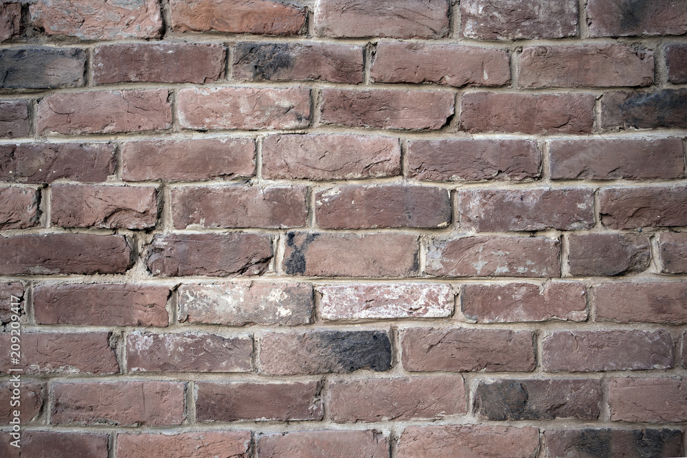 Old colorful resaturated brick wall texture, may be used as background Old colorful resaturated brick wall texture, may be used as background