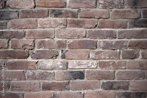 Old colorful resaturated brick wall texture, may be used as background photo