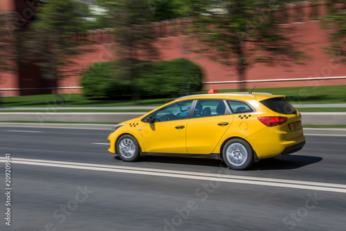 yellow taxi cab speeding