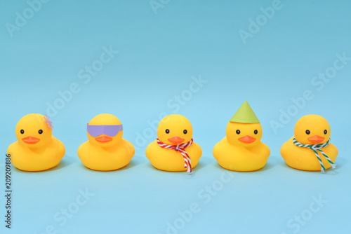 Diversity concept, Difference rubber ducks manage to line up.