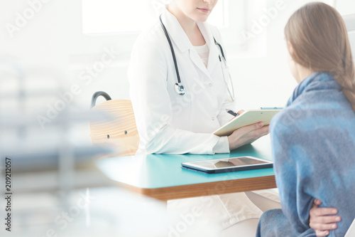 Woman during consultation with gynecologist photo