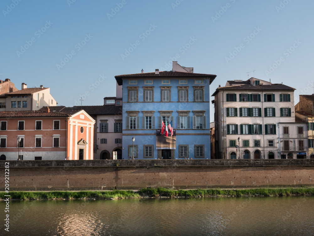 Heritage buildings in Pisa and the Arno river