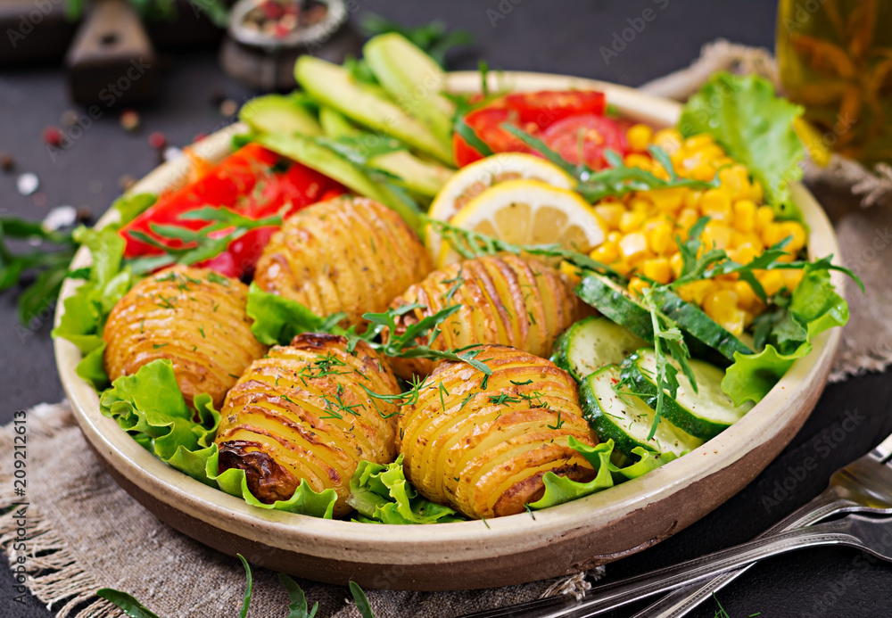 Vegetarian buddha bowl. Raw vegetables and baked potatoes in bowl. Vegan meal. Healthy and detox food concept. Vegetarian buddha bowl. Raw vegetables and baked potatoes in bowl. Vegan meal. Healthy and detox food concept.