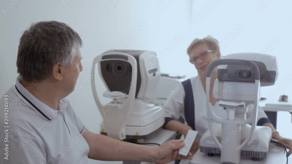 Happy adult man in ophthalmological clinic Happy adult man in ophthalmological clinic