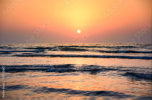 Seaside sunset scene on the beach
