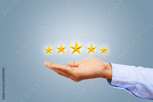 Hand of client giving a five star rating. Service rating, satisfaction concept