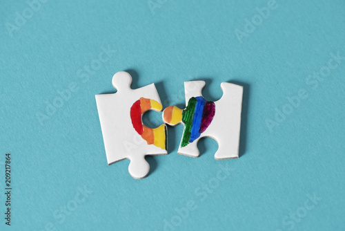 puzzle pieces about to form a rainbow heart. photo