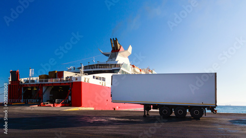 Ferry boat loading the truck on board in port. Semi-trailer with copy space.