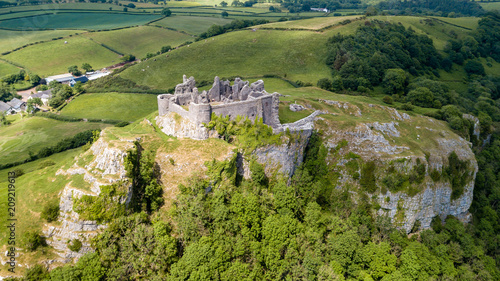 Aerial view of the ruins of Carreg Cennen Castle in the Camarthenshire countryside photo