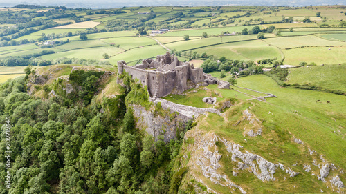 Aerial view of the ruins of Carreg Cennen Castle in the Camarthenshire countryside photo