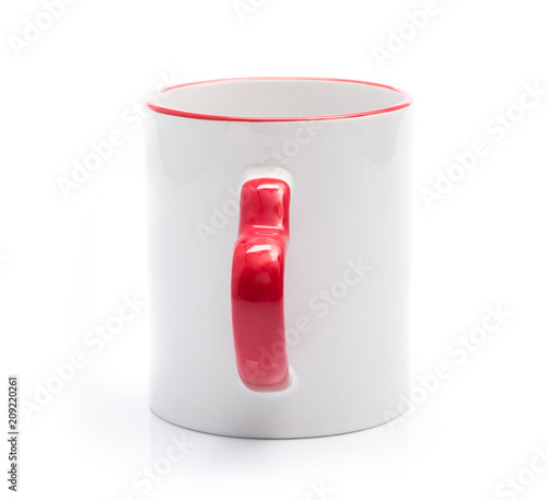 White cup with red rim and handle in heart shape isolated on a white background