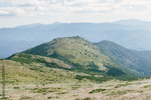 Fototapeta Góry wzgórza krajobraz zielone chmury