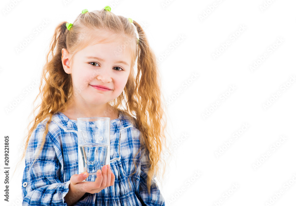Cute smiling little baby girl holding a glass of pure water isolated on white background Cute smiling little baby girl holding a glass of pure water isolated on white background