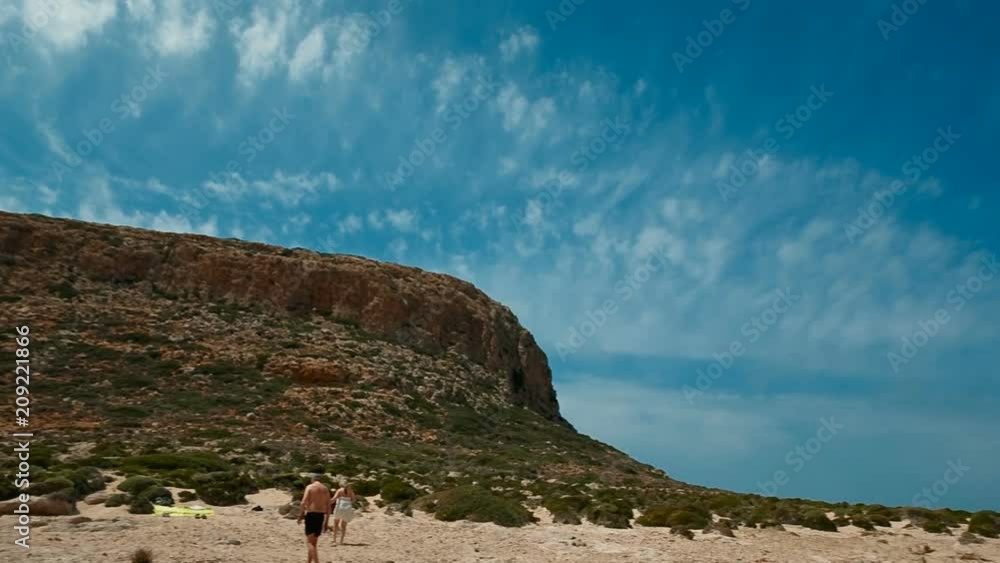 Tilting shot revealing the amazing Balos beach in Crete, Greece on a sunny day with a glorious blue sky Tilting shot revealing the amazing Balos beach in Crete, Greece on a sunny day with a glorious blue sky