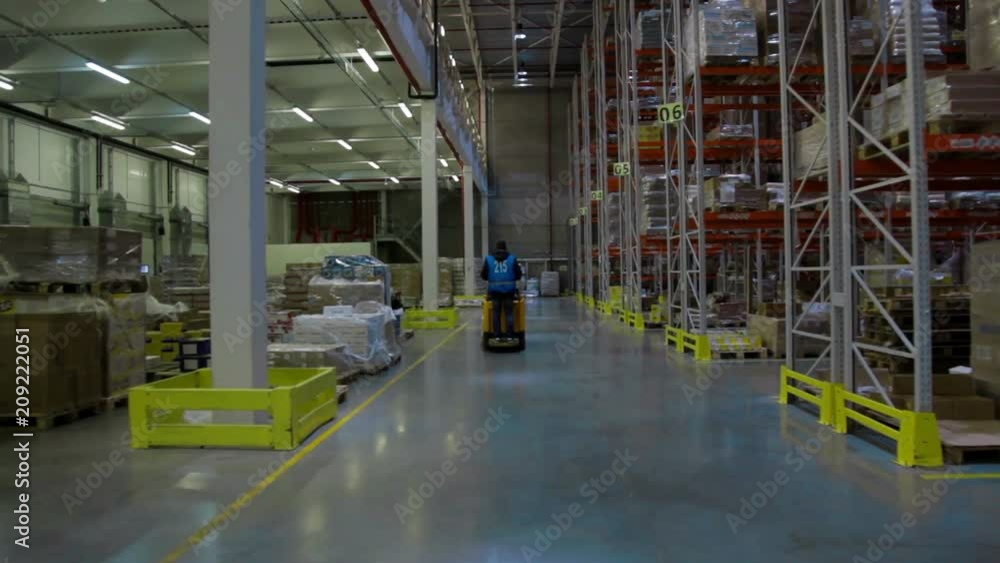 Camera moving between palettes with goods and materials at warehouse Camera moving between palettes with goods and materials at warehouse
