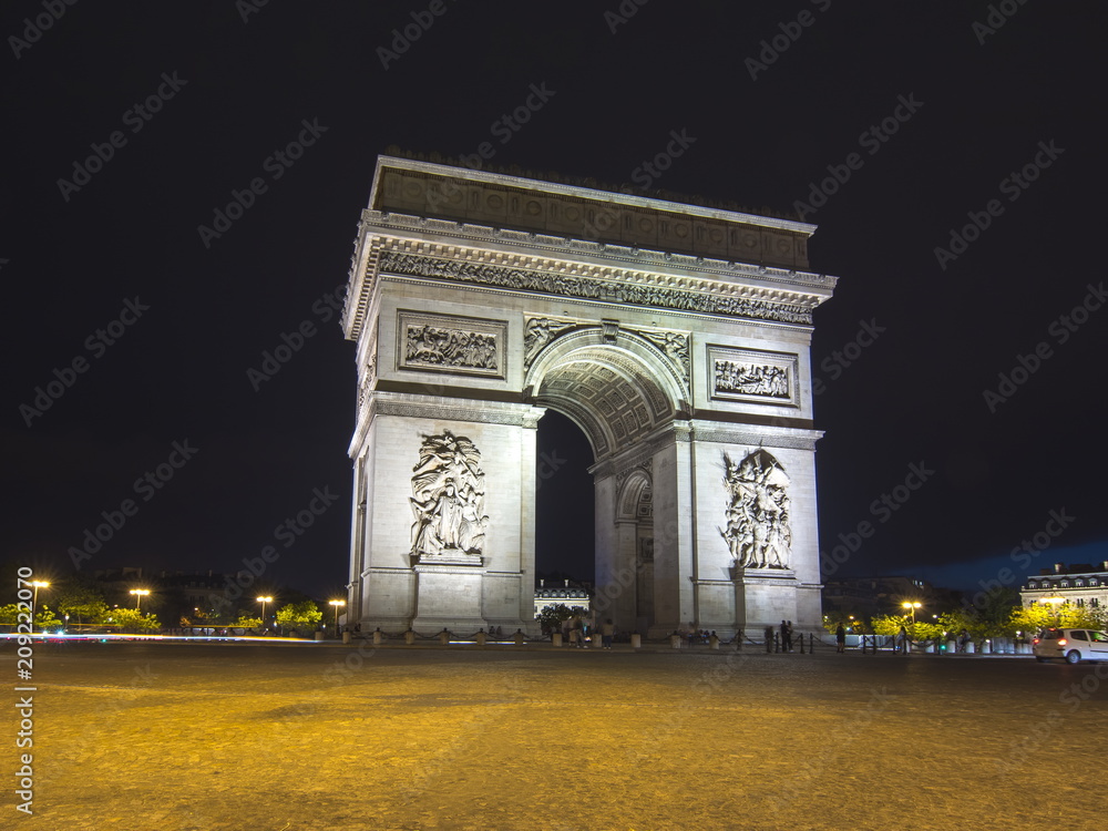Triumphal arch (Arc de Triomphe) at night, Paris, France