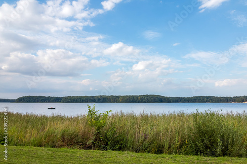 Sun over calm lake in the spring morning in Poland