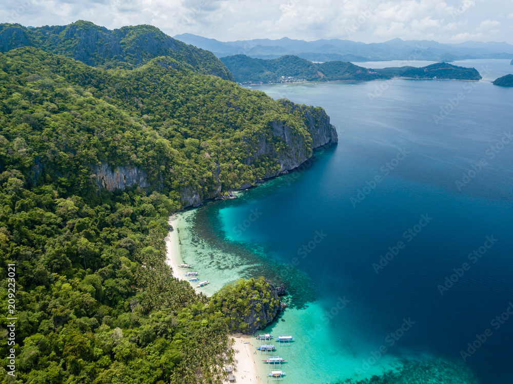 Aerial drone view of the scenic 7 Commando and Papaya beaches in El Nido, Palawan