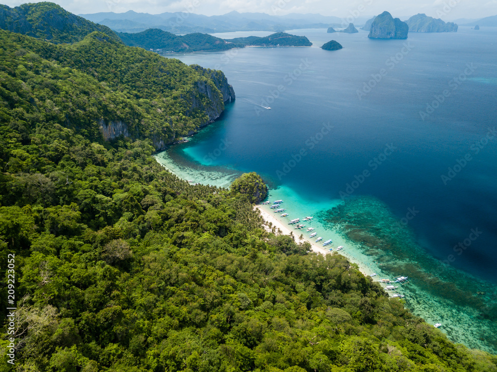 Aerial drone view of the scenic 7 Commando and Papaya beaches in El Nido, Palawan