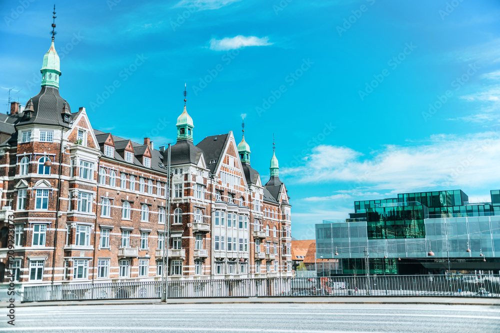 Naklejka premium urban scene with beautiful architecture of copenhagen and cloudy sky, denmark