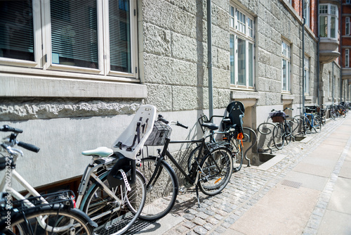 urban scene with bicycles parked on street in copenhagen, denmark