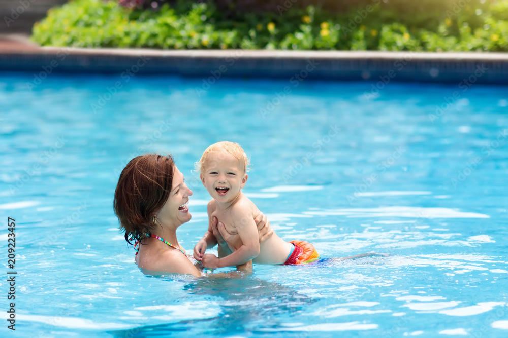 Mother and baby in swimming pool