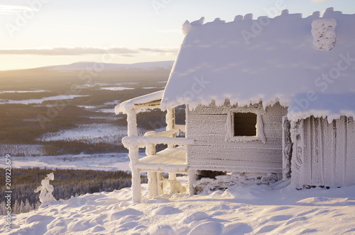 Frozen hut on a hill in Finland