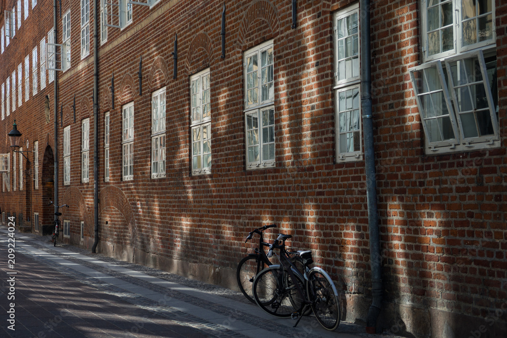 urban scene with bicycles parked on street, copenhagen, denmark