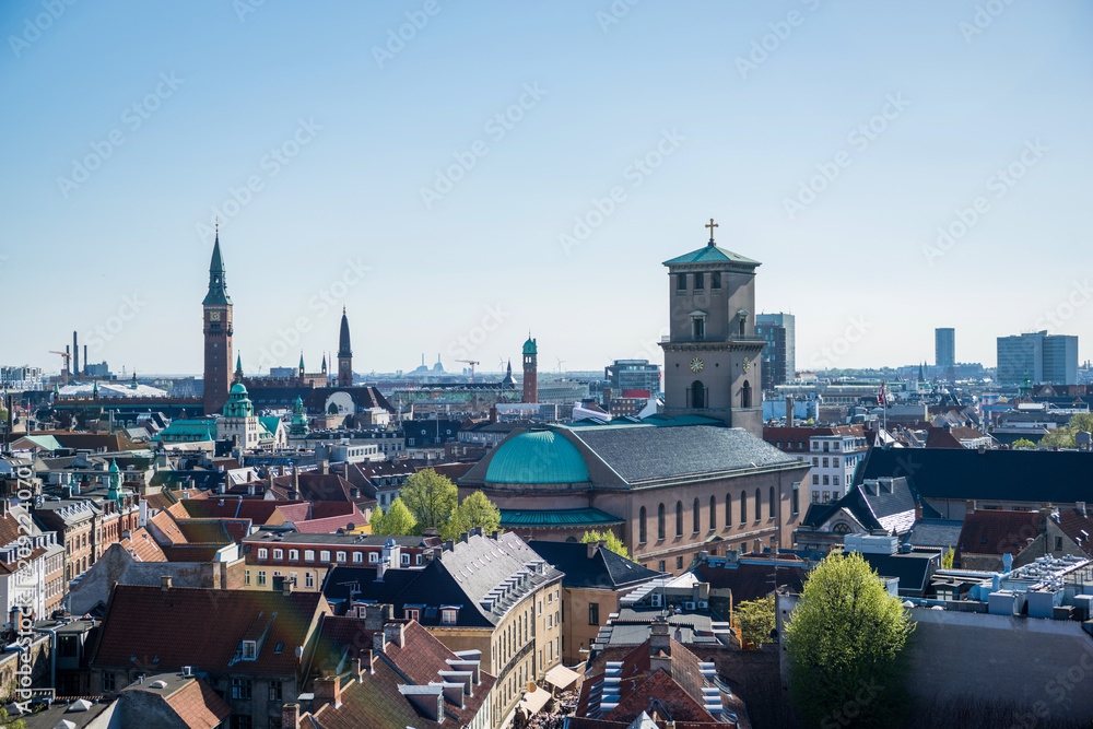 cityscape of Copenhagen with spire of City Hall, Denmark