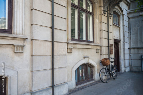 Photography bicycle with basket parked near old house in copenhagen, denmark