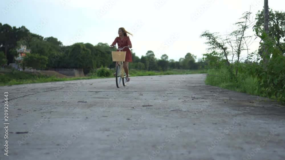 woman riding a bike on the park woman riding a bike on the park