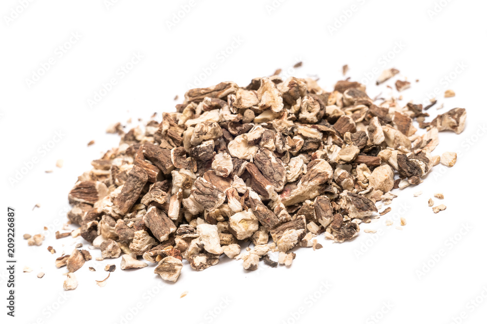 Organic dried dandelion root isolated on white background, dutch angle view Organic dried dandelion root isolated on white background, dutch angle view